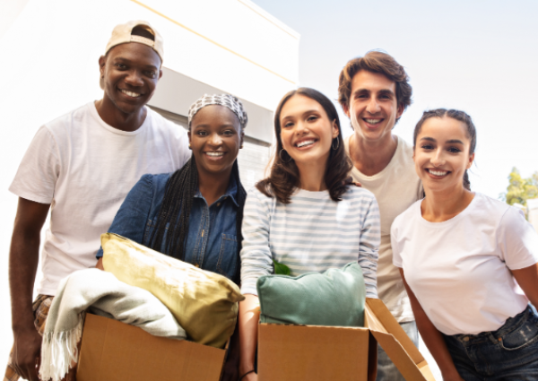 multicultural-group-of-students-holding-paper-boxe-2023-11-27-04-51-00-utc